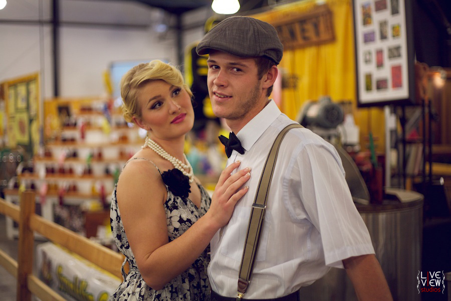 retro couple at the honey display, state fair