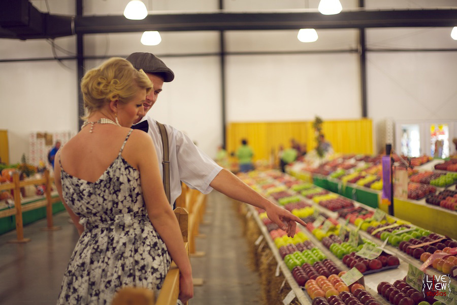 vintage couple looking at apples, nc state fair