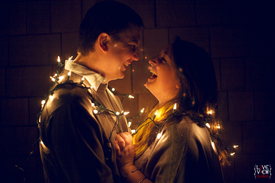 couple wrapped in lights, best outer banks engagement photos