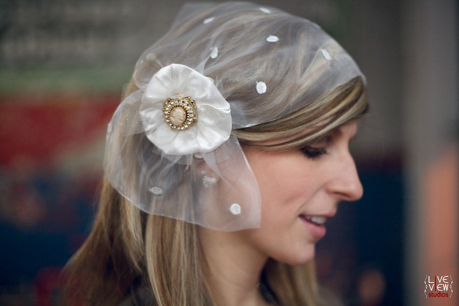 This one gives a nod to the 1920s style bridal caplets we love it
