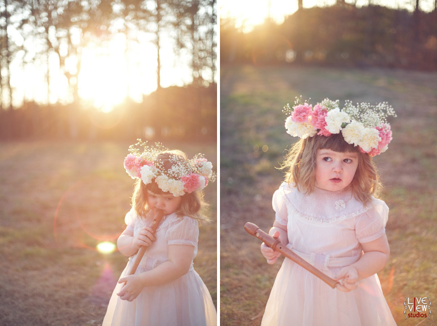 child with flute and floral wreath headpiece