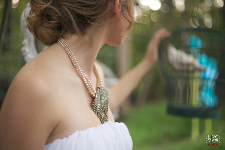 bride wearing pearl and rhinestone statement necklace, custom vintage wedding jewelry by oh so curio