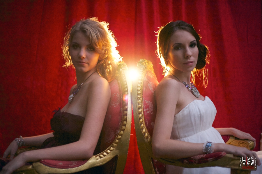 red curtain backdrop and vintage chairs, circus themed wedding photography inspiration