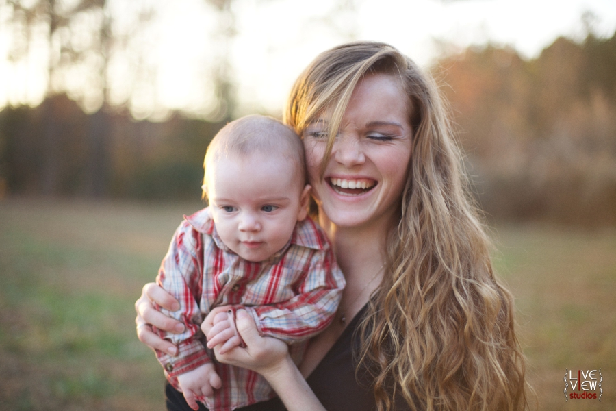 girl laughing with her little boy