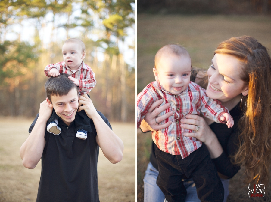 dad holding little boy on shoulders, mother smiles with child