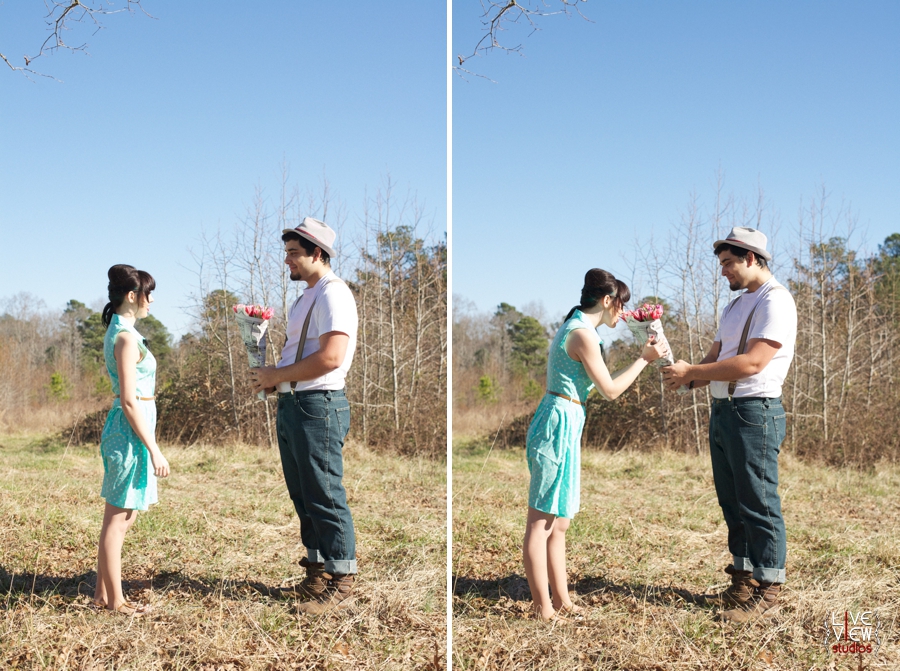 romantic valentine engagement photography, man bringing pretty pink flowers wrapped in newspaper for his girlfriend
