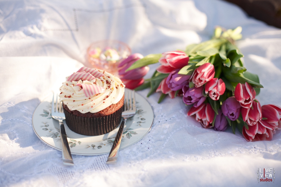 red velvet cupcake topped with creamy icing and peppermint curls, valentine's day picnic inspiration