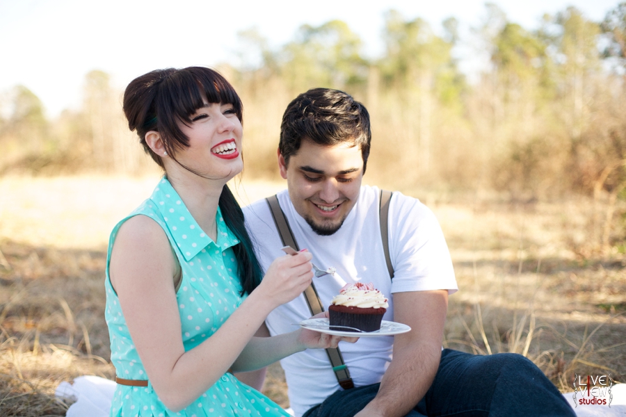 a couple shares a cupcake on a valentine's day picnic, vintage inspired couple's photography