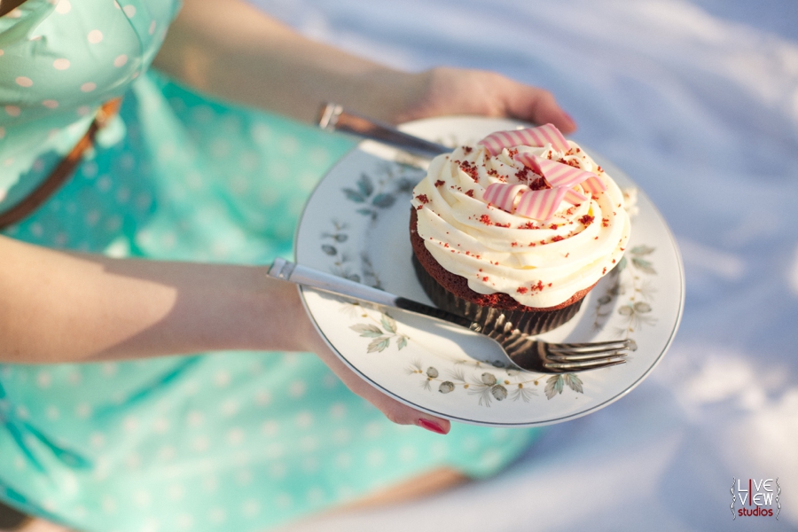 red velvet cupcake covered with creamy icing and striped peppermint slices, raleigh nc food photography