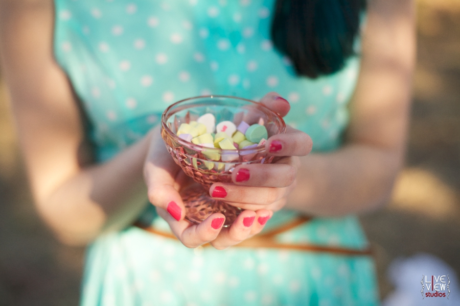 woman holding a glass goblet with colorful sweetheart candies, raleigh nc portrait photographers