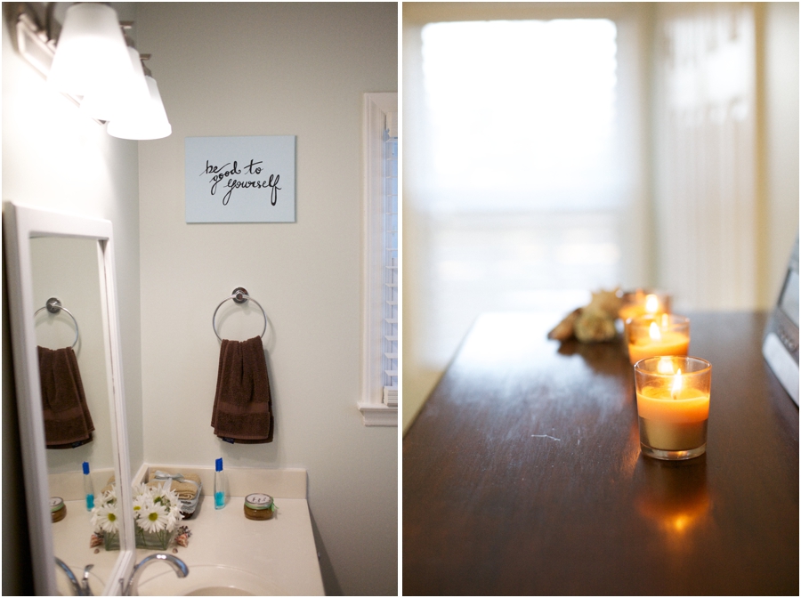 whitened sage wall color contrasted dark brown hand towel, candles lit on chester drawers, bright interior decoration ideas 