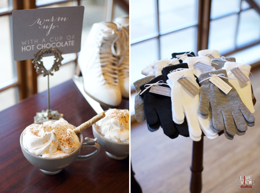 winter wedding reception inspiration, mugs of hot chocolate with whipped cream on top, pairs of cream, grey, and black gloves as wedding favors