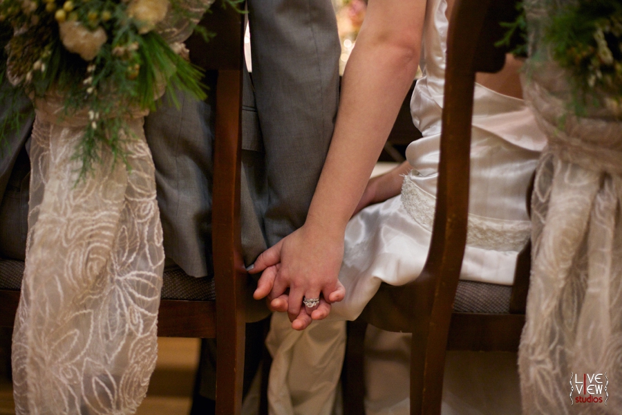 bride and groom holding hands at reception table, winter wedding inspiration, raleigh nc wedding photographers
