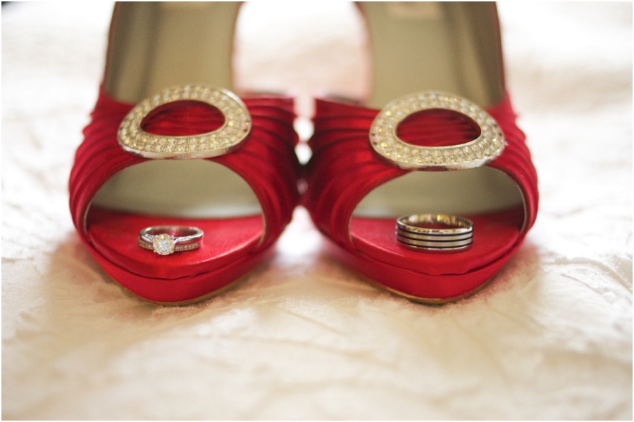 cool ring shot ideas, wedding bands on bride's cherry red high heels