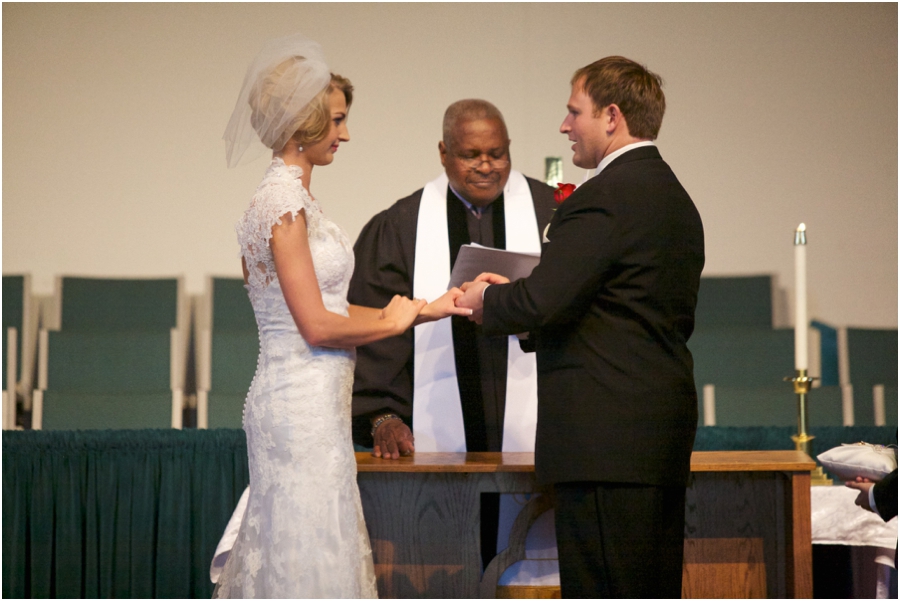 bride and groom making their vows at the alter, southern wedding photographers, raleigh nc