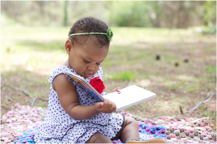 raleigh baby photography, baby girl reading a book