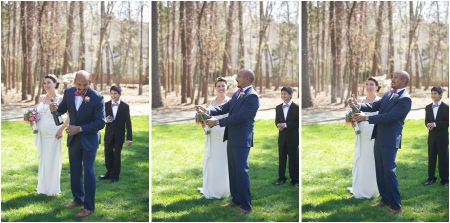 groom popping the champagne after the ceremony 