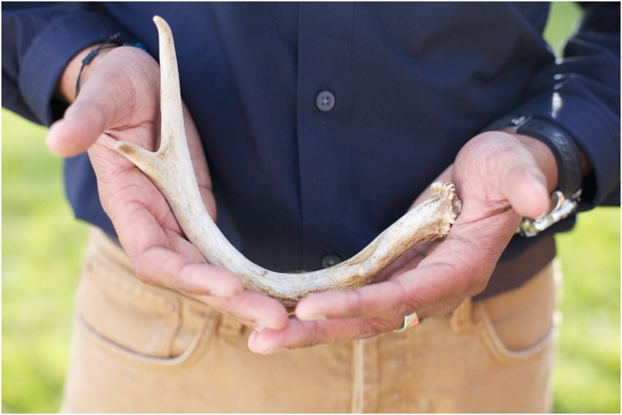 man holding deer antler, cloer vineyard engagement photography, raleigh nc