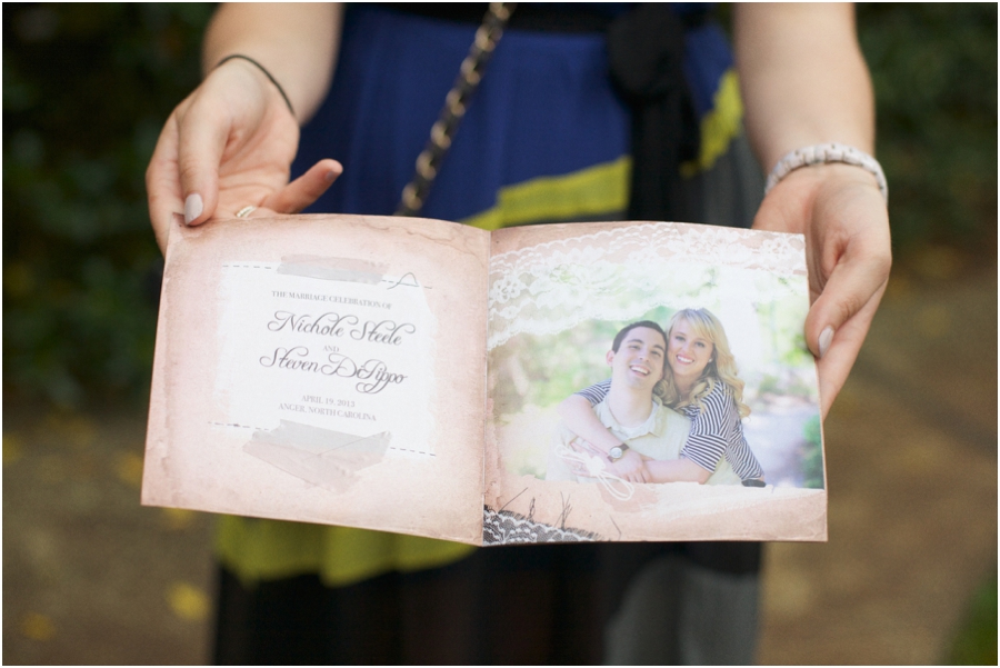 guest holding out wedding program, romantic southern wedding photographers