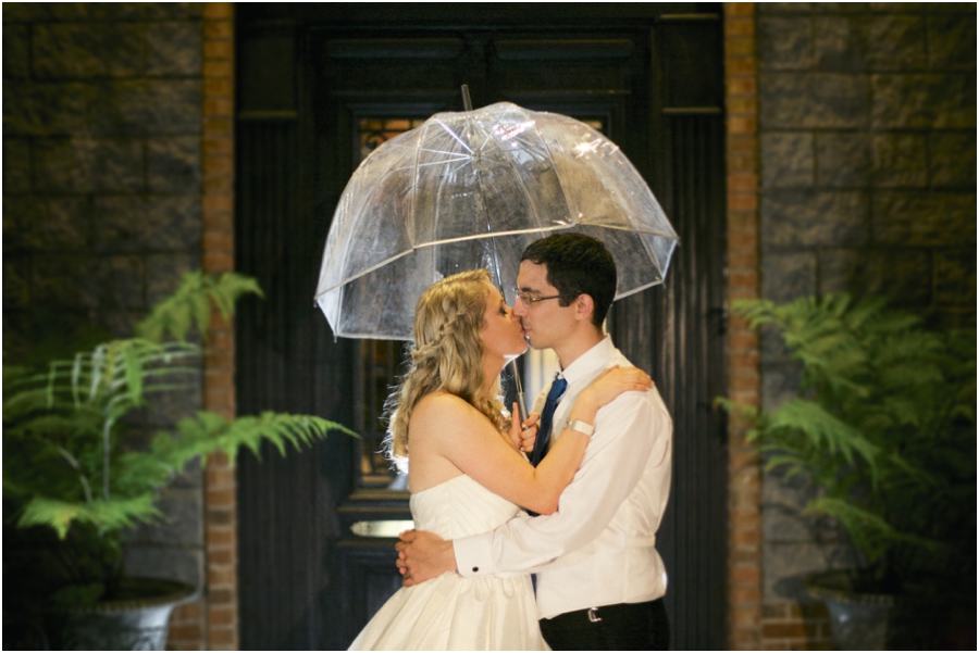 romantic southern wedding photography, bride and groom kissing in the rain