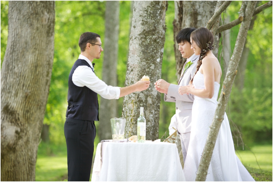 bride and groom having communion at wedding ceremony 