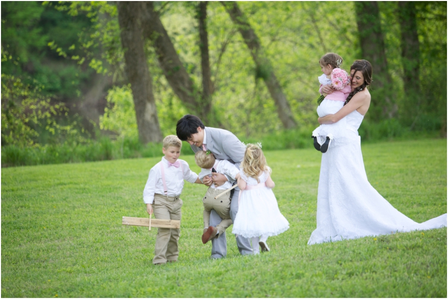 bride and groom with sign bearers and flower girls, forest wedding photography, southern wedding photographers