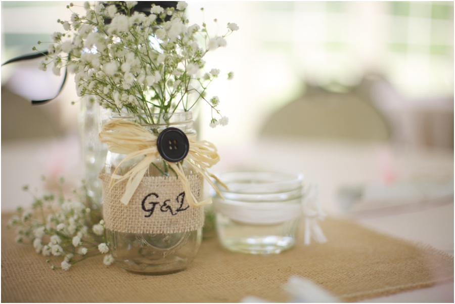 rustic wedding reception ideas, baby's breath in a mason jar wrapped in burlap 