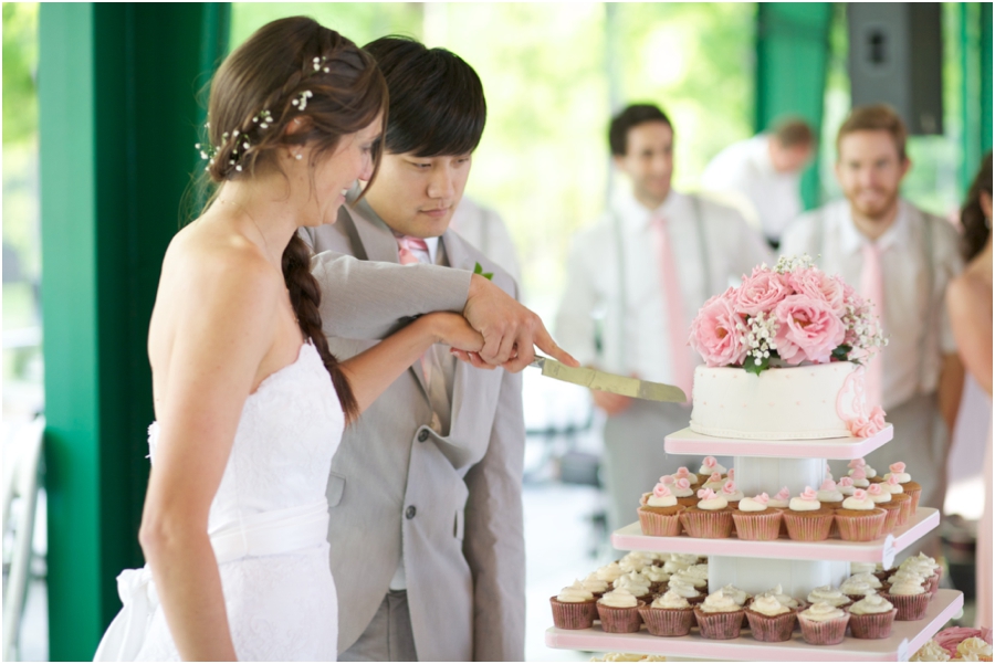 bride and groom cutting the cake, rustic wedding photographers