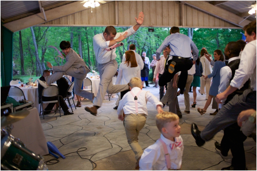 groom and groomsmen dancing at wedding reception, rustic wedding photographers