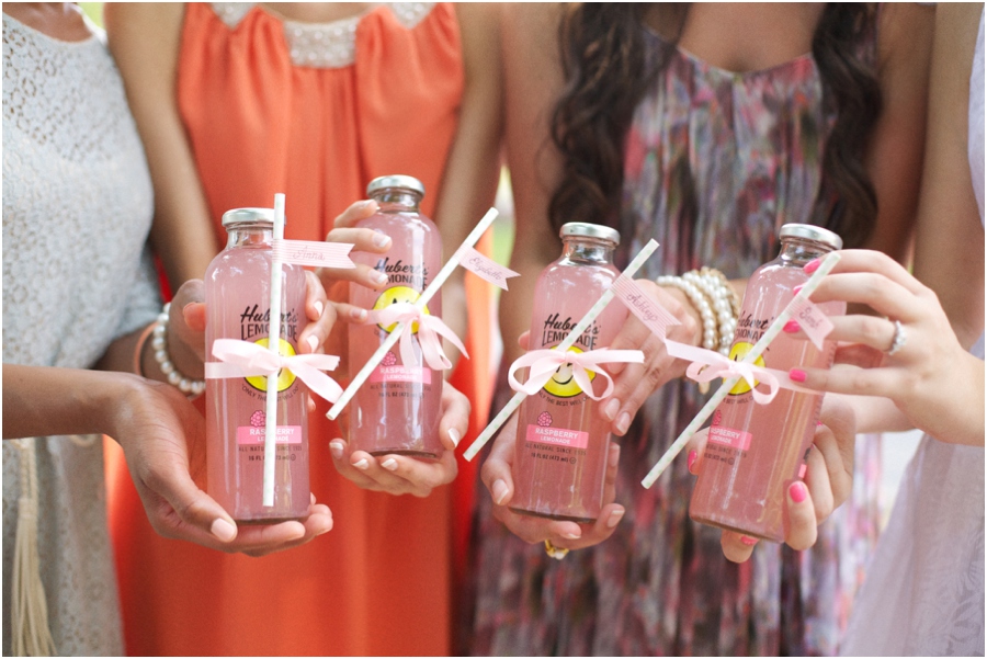 southern bridesmaids holding out bottles of pink lemonade, summer bridal luncheon, vintage wedding photographers