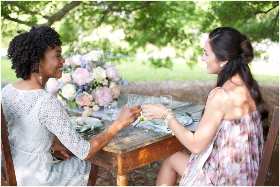 beautiful southern photography, friends clink glasses at summer bridal luncheon, vintage wedding photographers