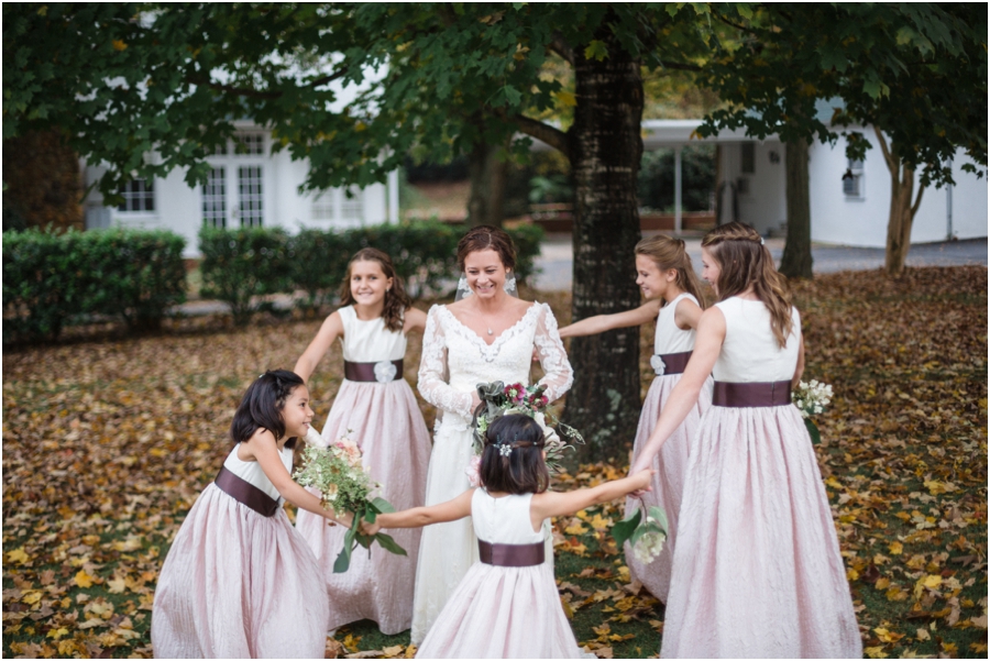 junior bridesmaids dancing around the bride, bohemian bridal photography